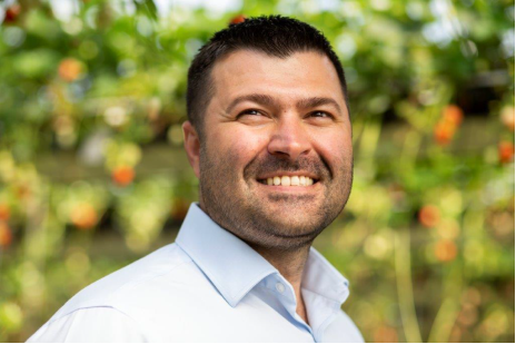 a man smiling outside